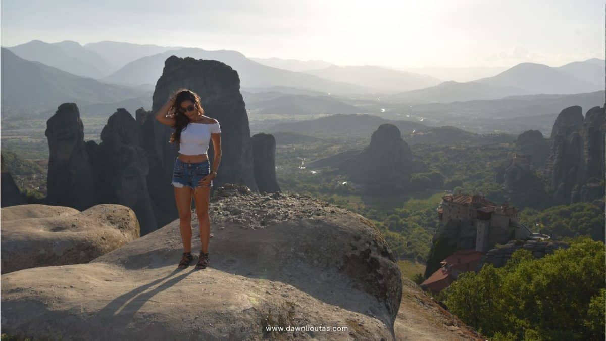 View of Meteora in Greece with rock formations and monastery, popular destination reachable by bus or train