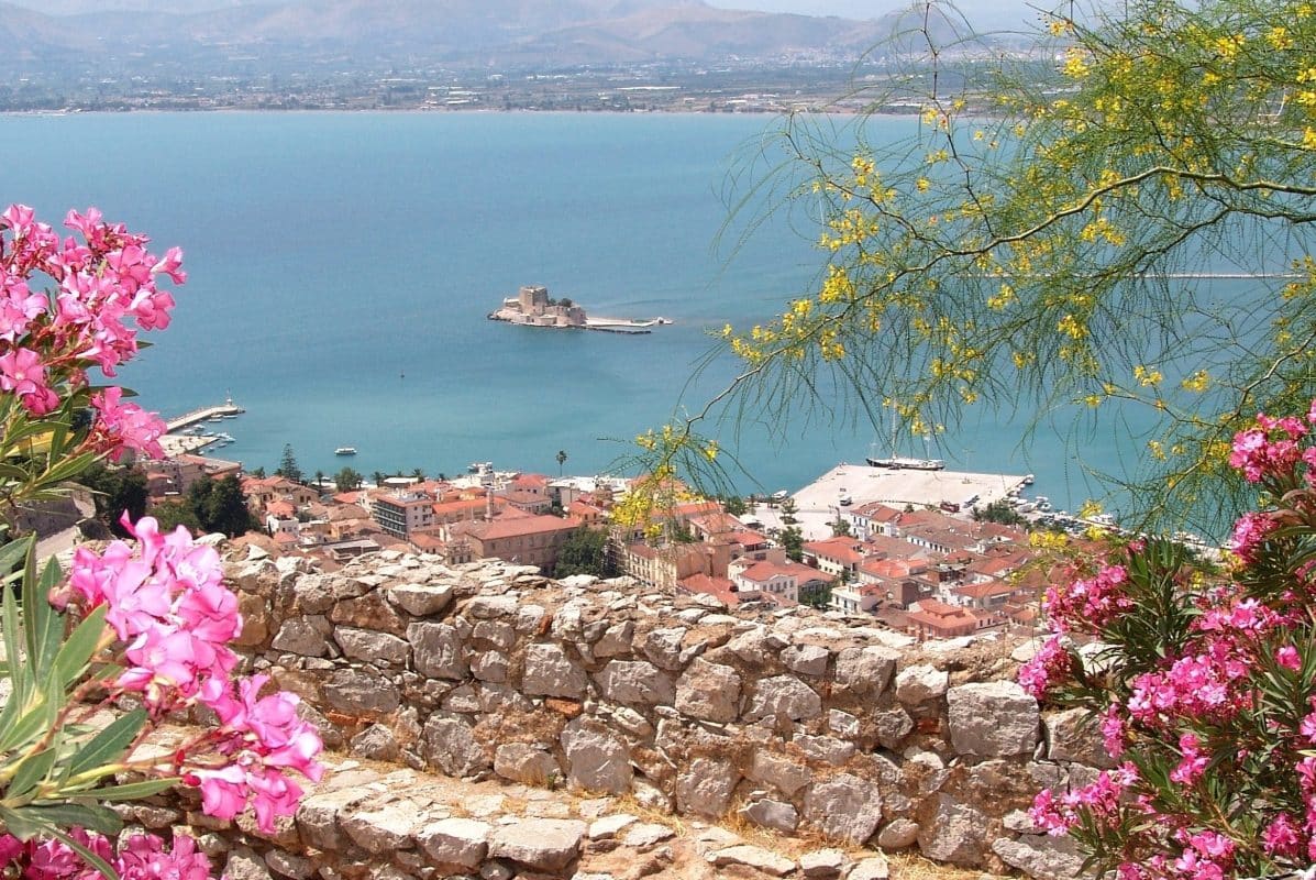 View of Nafplio Greece with Bourtzi castle and coastline, a popular mainland destination reachable by bus