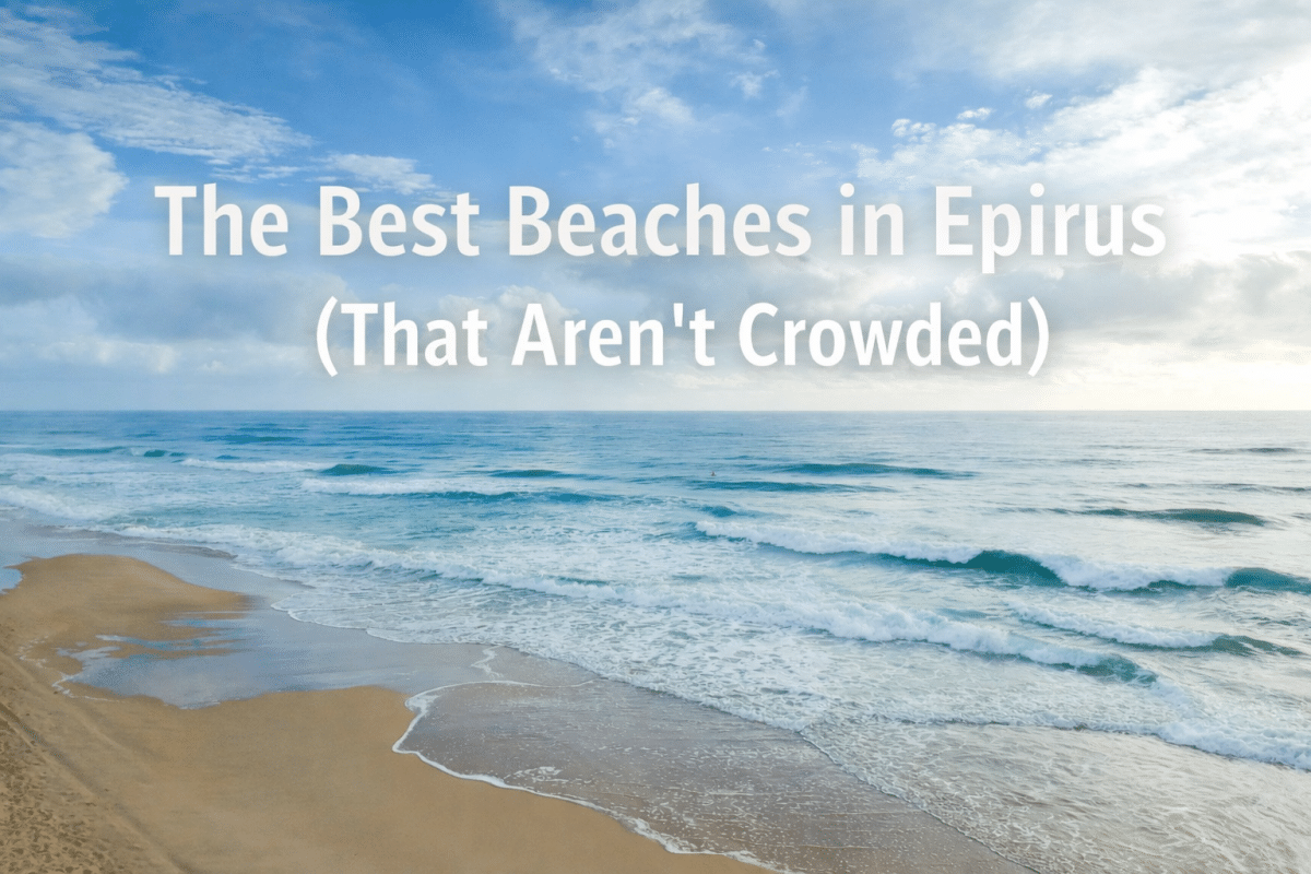 Serene sandy beach in Epirus, Greece with gentle waves rolling onto shore under a soft blue sky, featuring overlaid text reading “The Best Beaches in Epirus (That Aren’t Crowded).”