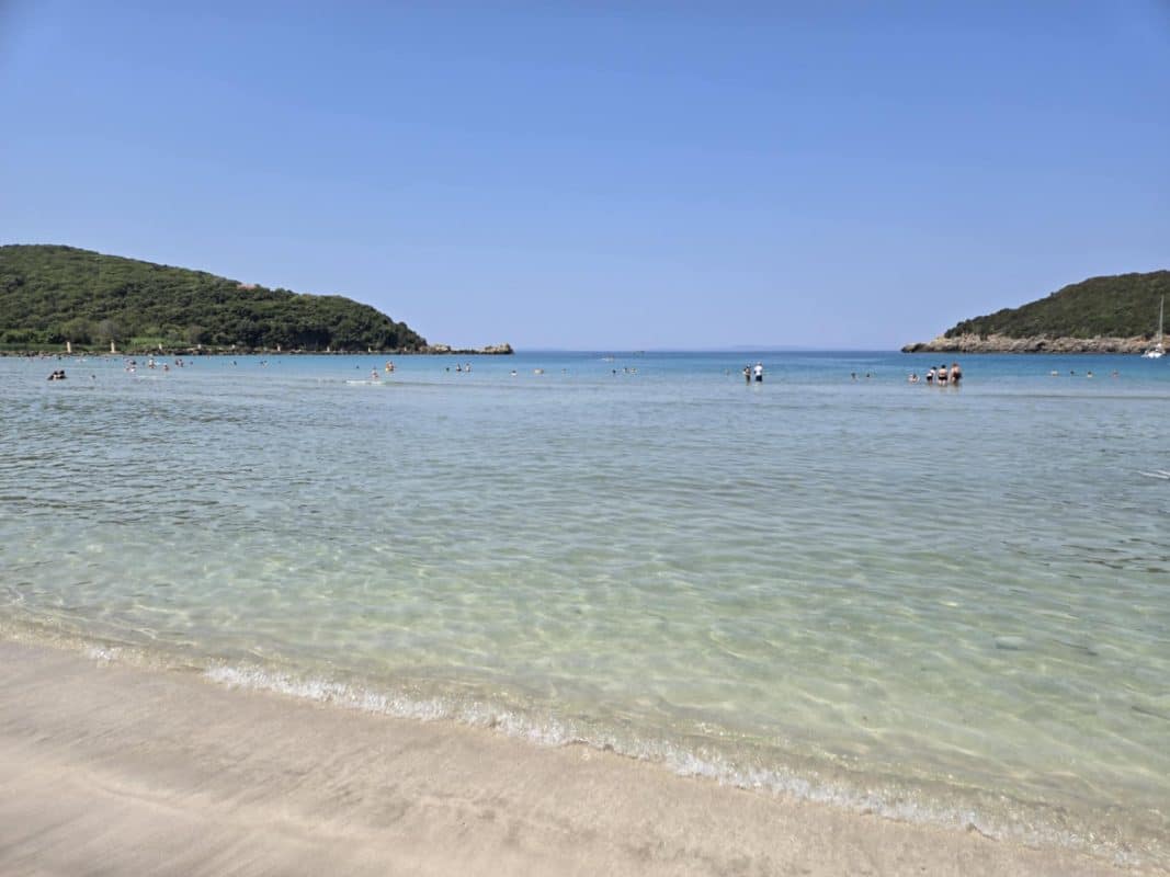 Ammoudia Beach in Epirus Greece with shallow turquoise Ionian Sea water and sandy shoreline