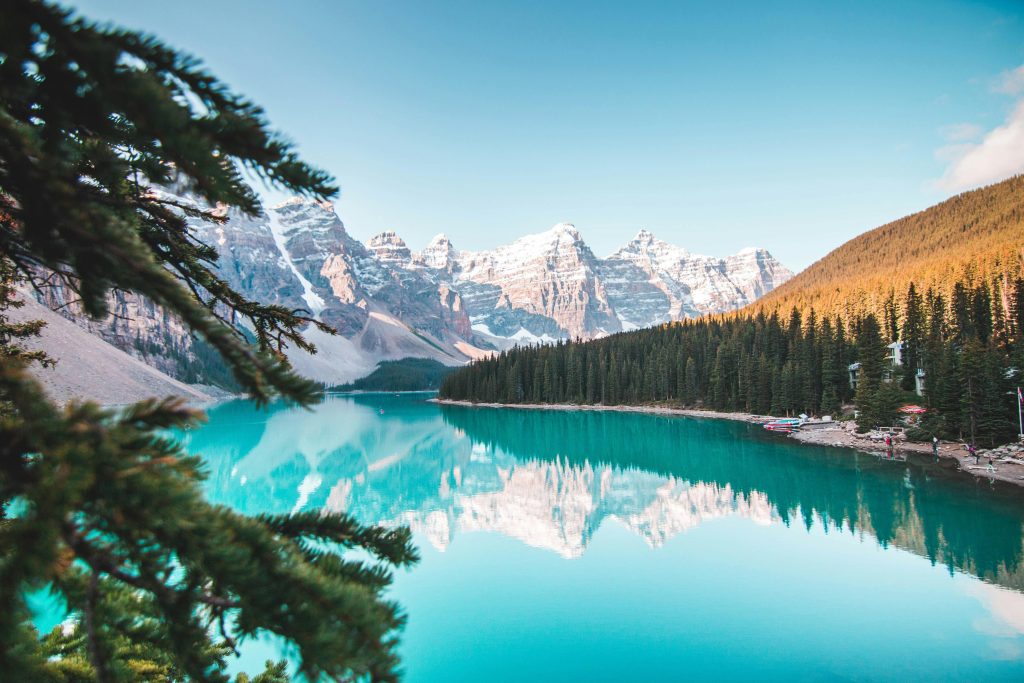 Turquoise Moraine Lake in Banff National Park with Rocky Mountains reflection