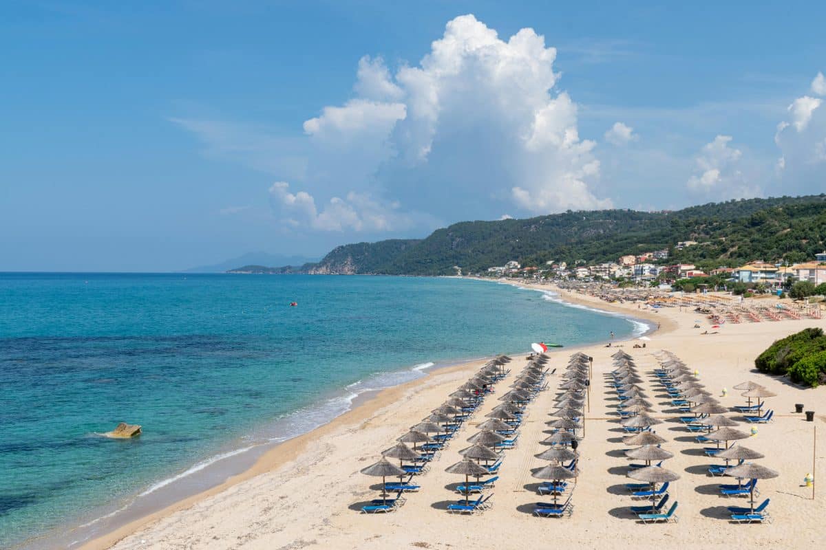 Vrachos Beach in Epirus Greece with long sandy shoreline and turquoise Ionian Sea water