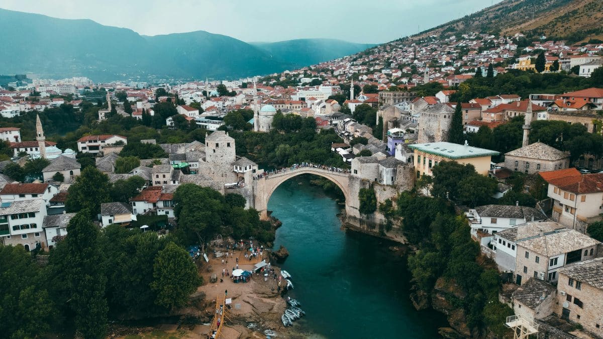 Stari Most Old Bridge in Mostar Bosnia and Herzegovina over the Neretva River surrounded by historic stone buildings