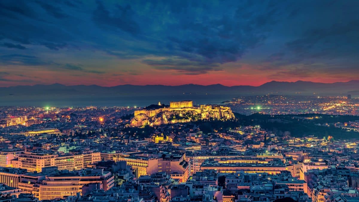 Acropolis in Athens illuminated at night during a trip to Greece