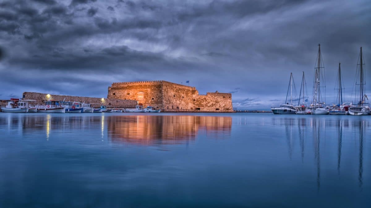The Venetian fortress Koules illuminated at night in the harbor of Heraklion, Crete.