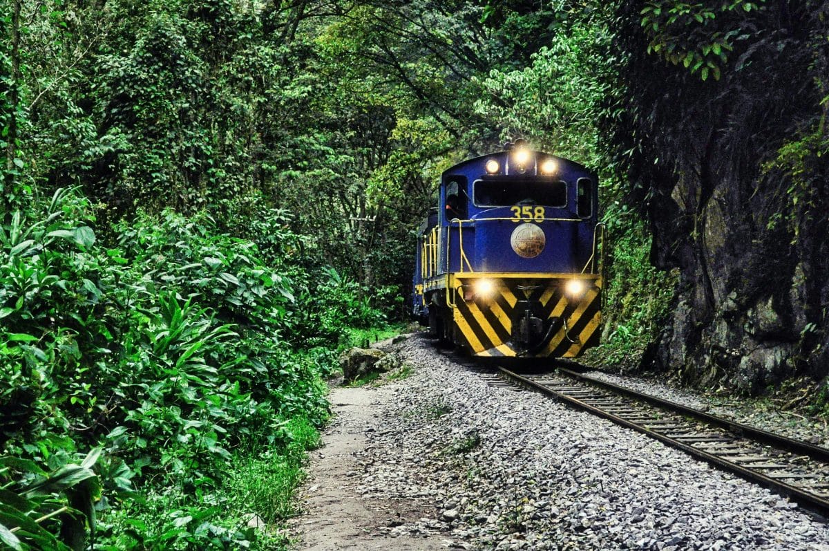 train through Sacred Valley to Machu Picchu Peru jungle railway