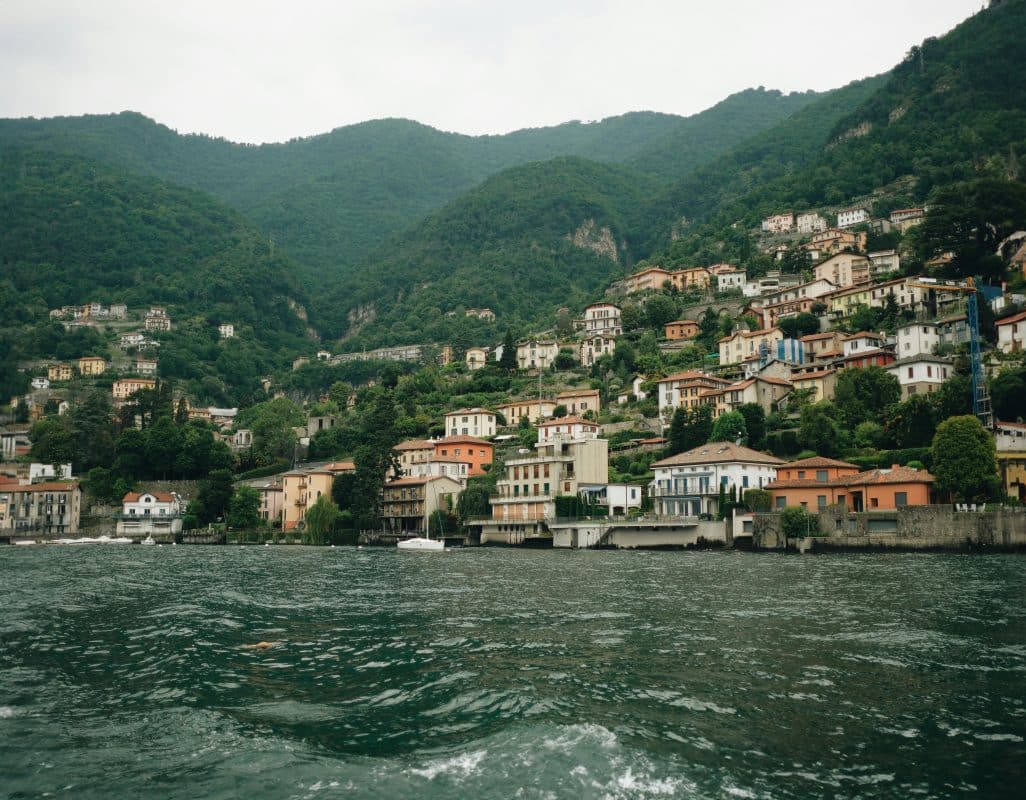 Colorful lakeside villages along Lake Como in northern Italy with mountains and waterfront views