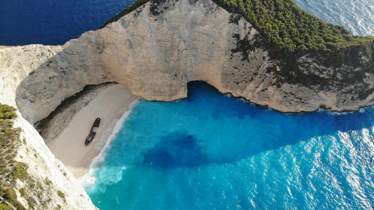 Navagio Beach shipwreck cove in Zakynthos Greece with turquoise water and cliffs