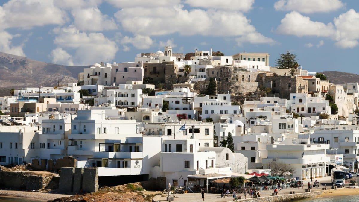 White buildings and port town in Naxos, Greece with traditional Cycladic architecture
