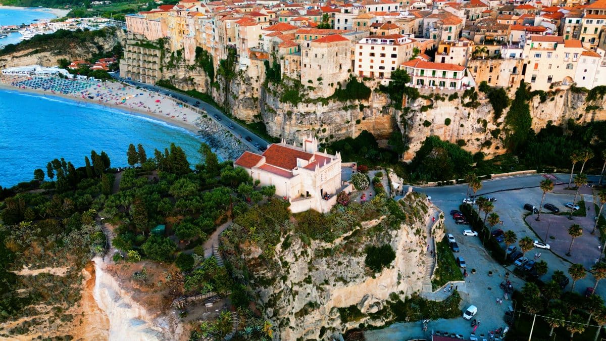Tropea Calabria Italy cliffside town overlooking turquoise sea and sandy beach
