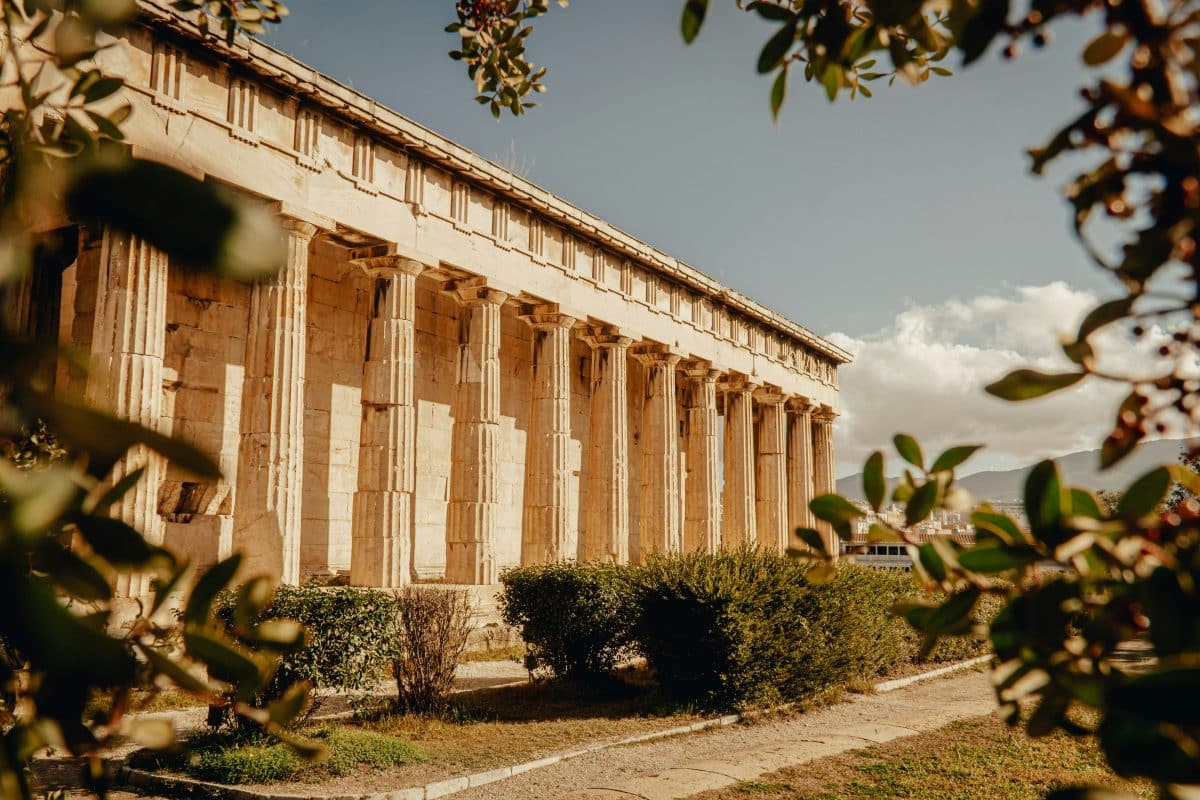 The Temple of Hephaestus at the Ancient Agora of Athens surrounded by greenery
