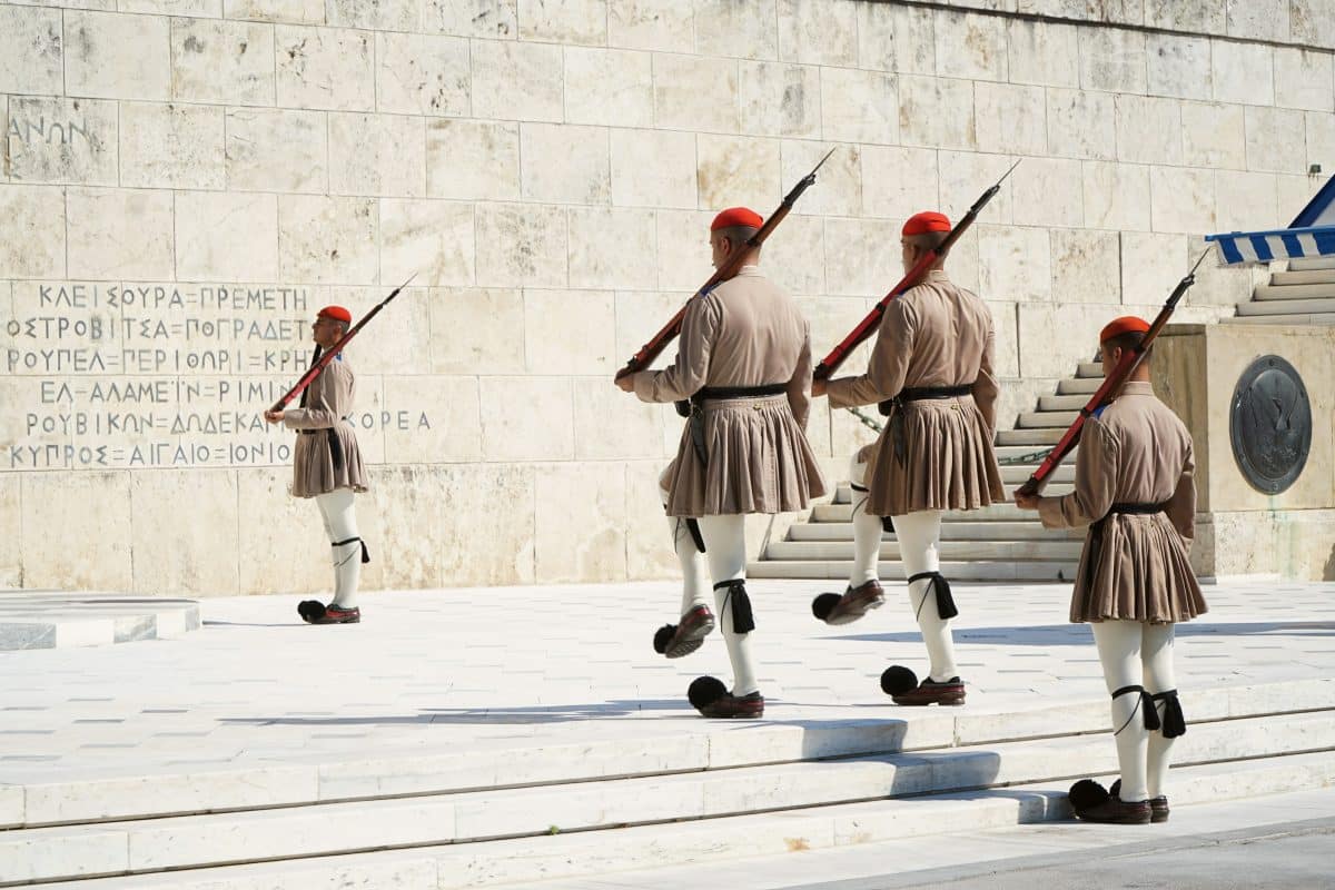 Greek Evzone guards performing the changing of the guards ceremony outside Parliament in Athens