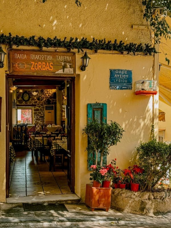 Traditional taverna and charming street scene in the Plaka neighborhood of Athens, Greece