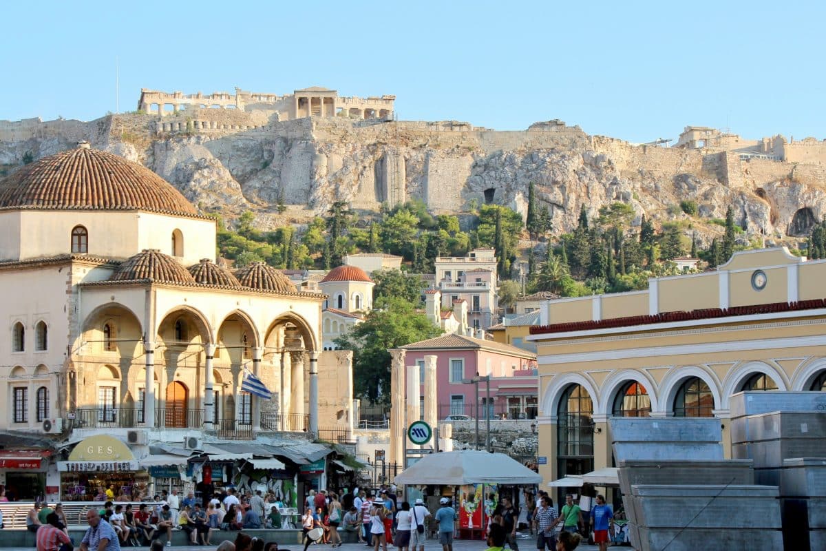 Monastiraki Square in Athens with historic buildings and the Acropolis rising in the background