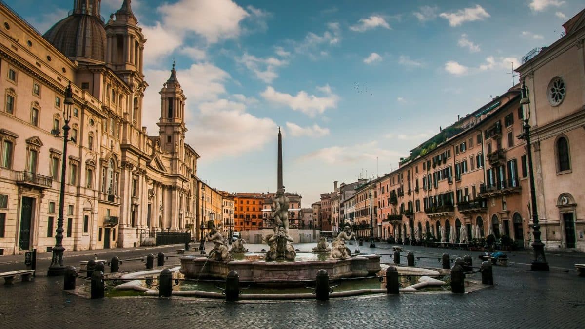 Piazza Navona in Rome, Italy with historic buildings and fountain in the early morning