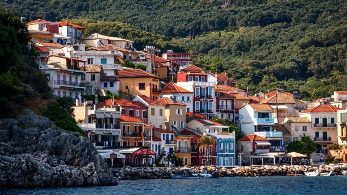 Colorful hillside buildings overlooking the waterfront in Parga, Greece.