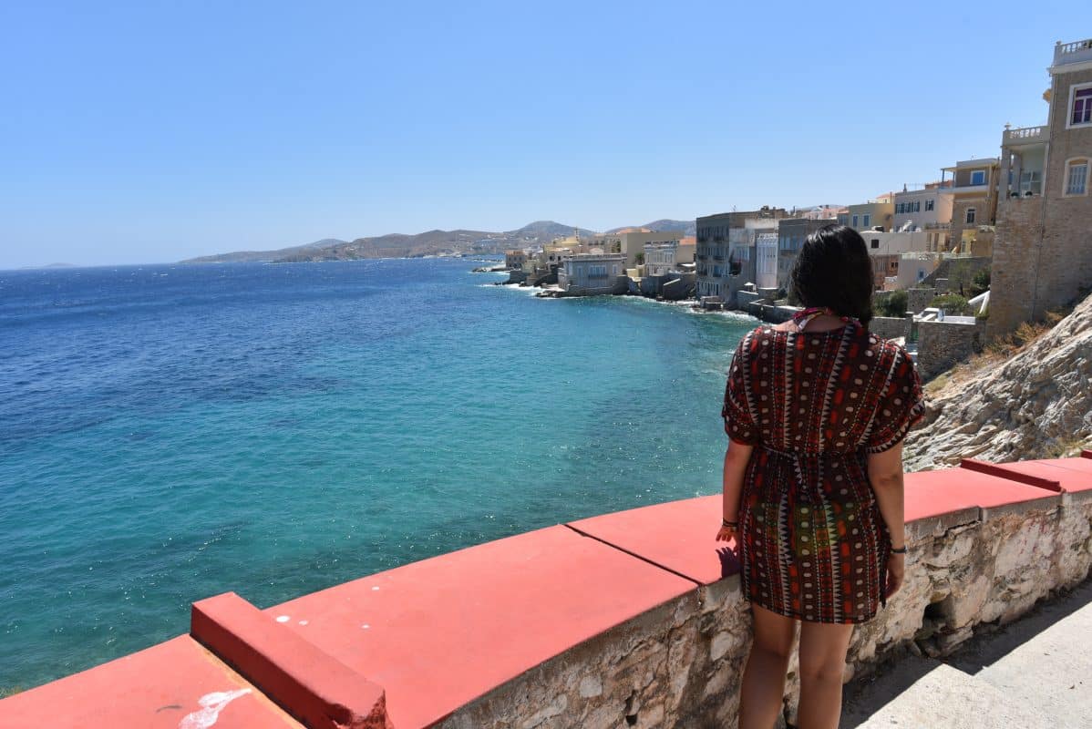 View over the coastline and colorful waterfront buildings in Ermoupoli, Syros, Greece.