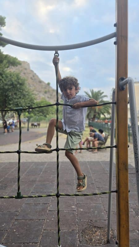 Child playing on the playground at Kolokotronis Park in Nafplio, Greece
