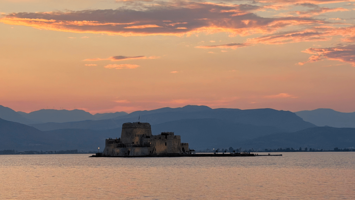 Bourtzi Castle at sunset from the Nafplio waterfront in Greece